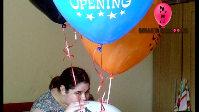 Popping Helium Balloons With Scissors video from