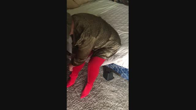 The Fetish Rose struggles with her new pair of Thigh High boots. video from Mistress Rose