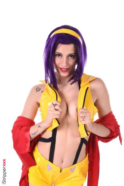 Beautiful stripper Christy posing in a yellow latex costume Image #3