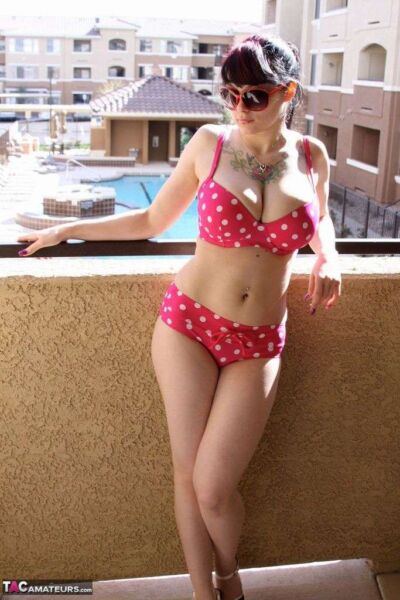 Busty amateur Susy posing in a polka dot bikini Image #1