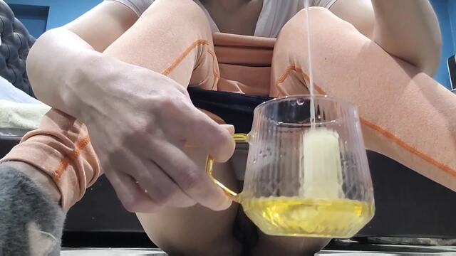 When it pours out of me. Pissing fetish in a container. video from KristinaSlut