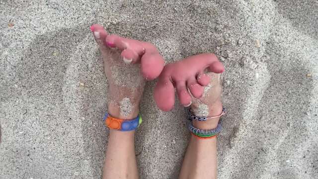 Sandy Feet With Painted Toes