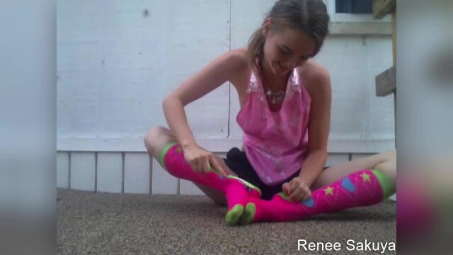 Tickling feet threw long kneesocks sitting outside and laughing video from Renee Sakuya