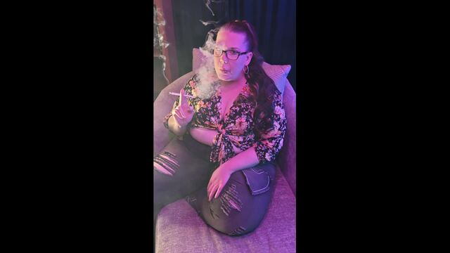 Sitting on my chaise lounge in a pretty flowered top and jeans smoking video
