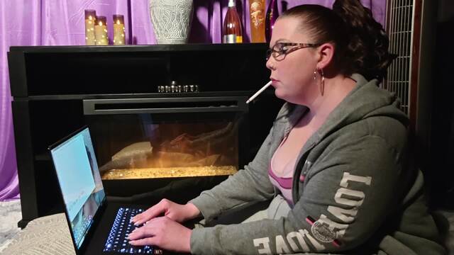 Working on my laptop sitiing on the floor smoking video from Brianna Rose