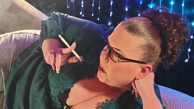 Laying on my side in my new green blouse smoking a VS 120 video from Brianna Rose